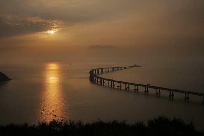 The Hong Kong-Zhuhai-Macau Bridge is seen against the sunset in Hong Kong. (AP Photo/Kin Cheung)