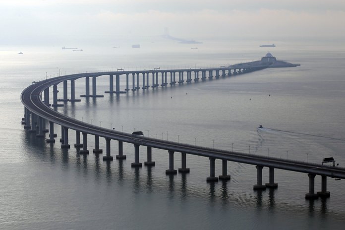The 55-kilometer (34-mile)-long bridge includes an undersea tunnel allowing ships to pass through the Pearl River delta, the heart of China’s crucial manufacturing sector. (AP Photo/Kin Cheung)