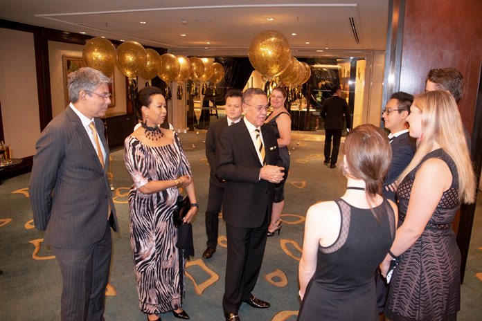 H.E. Geoff Doidge and Madame Carol greet the guests. At left is Ragil Ratnam, the Chairman of the South Africa Thailand Chamber of Commerce.