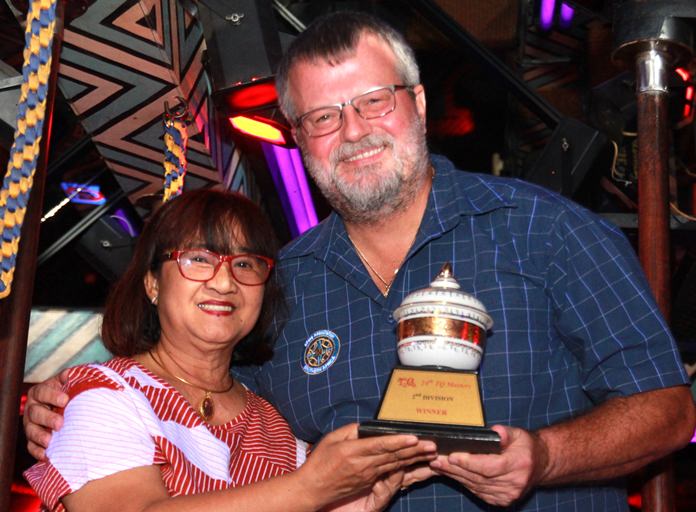 B Flight winner Daniel Tobler accepts his trophy from Mama-san Ead.