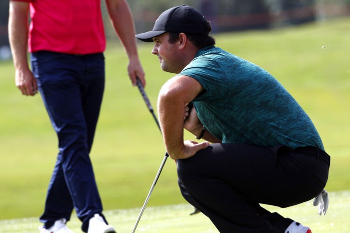 Patrick Reed of the United States lines up his shot during the HSBC Champions golf tournament held at the Sheshan International Golf Club in Shanghai, Thursday, Oct. 25. (AP Photo/Ng Han Guan)