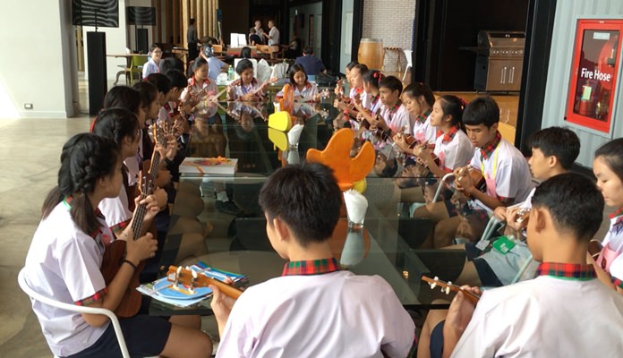 The 21 Bamboo School students get in some rehearsal time before entering the PCEC meeting.