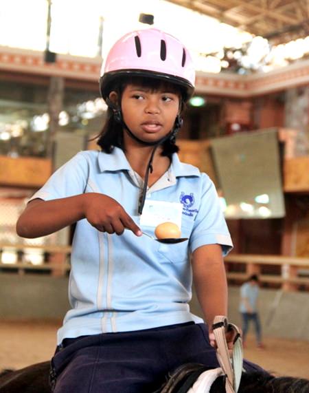 Egg and spoon race on horseback proved to be great fun.