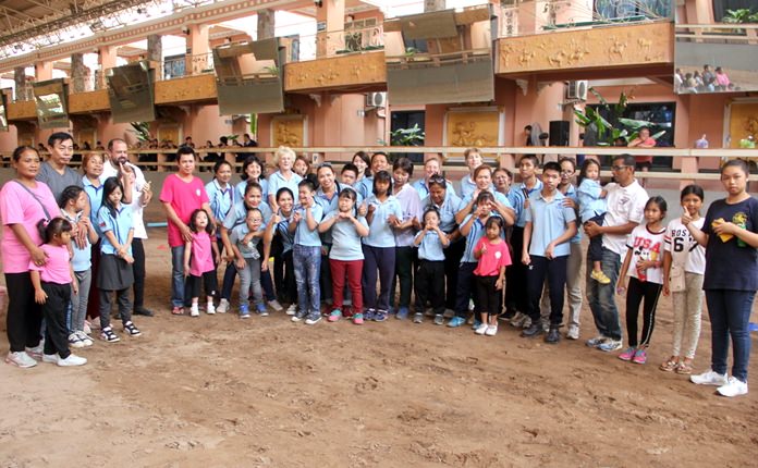 Children, parents and helpers pose for a group photo during the Gymkhana Games at Horseshoe Point in Pattaya, October 28.