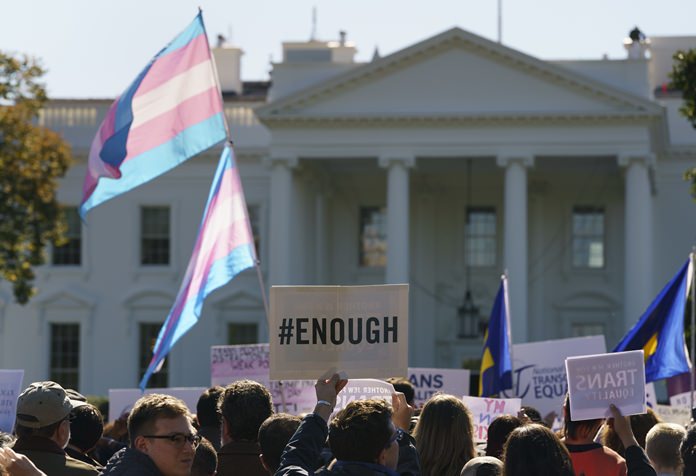 The National Center for Transgender Equality, NCTE, and the Human Rights Campaign gather on Pennsylvania Avenue in front of the White House in Washington, Monday, Oct. 22, 2018, for a #WontBeErased rally. Anatomy at birth may prompt a check in the "male" or "female" box on the birth certificate - but to doctors and scientists, sex and gender aren't always the same thing. (AP Photo/Carolyn Kaster)