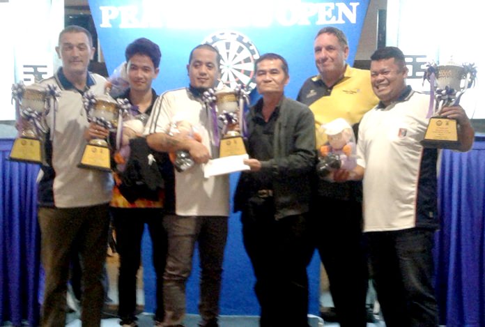 The PSC darts team players are presented with their trophies at the 2018 PEA Darts Open in Bangkok, Sunday Oct. 22.