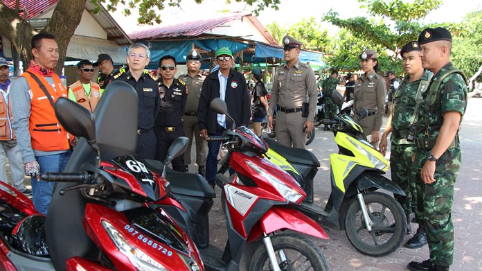 Regional transportation officials inspected baht buses and motorcycle taxis on Koh Larn and warned them to follow the law for Loy Krathong.