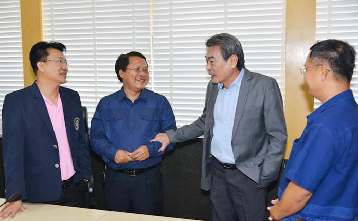 Deputy Mayor Ronakit Ekasingh, Peng Buahom, and Baborn Moonsaku, survey Meeting Room 134 at city hall.