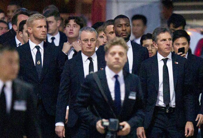Players and officials of the English Premier League club Leicester City arrive at a Buddhist temple to participate in the funeral rituals of Vichai Srivaddhanaprabha in Bangkok, Sunday, Nov. 4. (AP Photo/Gemunu Amarasinghe)