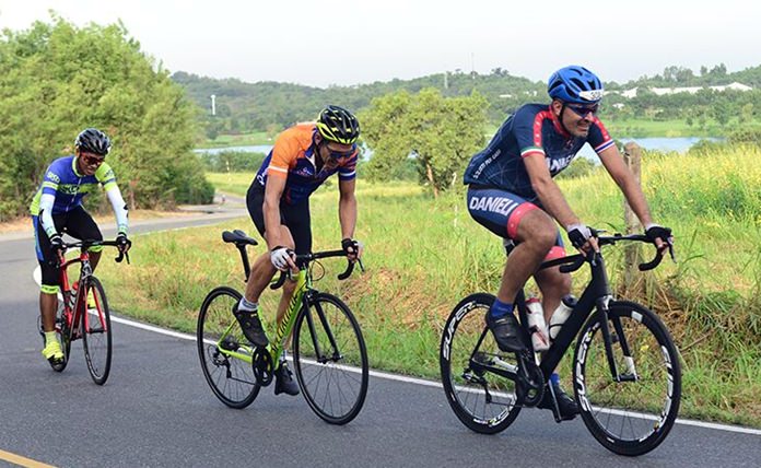 Cyclists compete in the male Open category over a 62km scenic course around Siam Country Club.