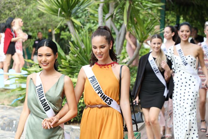 Miss Thailand Universe Sopita Kanchanarin and Miss Philippines Universe Catriona Gray lead contestants in the Miss Universe pageant on a tour of the Sea Turtle Conservation Center in Bang Saray.