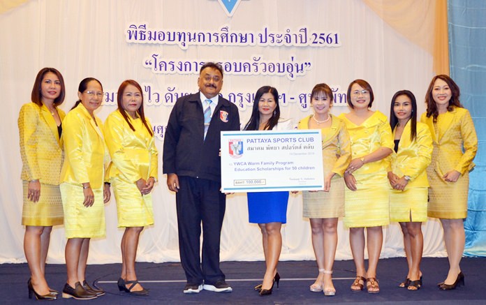 Peter Malhotra, MD of Pattaya Mail and President of the Pattaya Sports Club, and Noi Emerson, Pattaya Sport Club Social Welfare Chairperson present 100,000 baht in scholarships to the YWCA Bangkok-Pattaya.