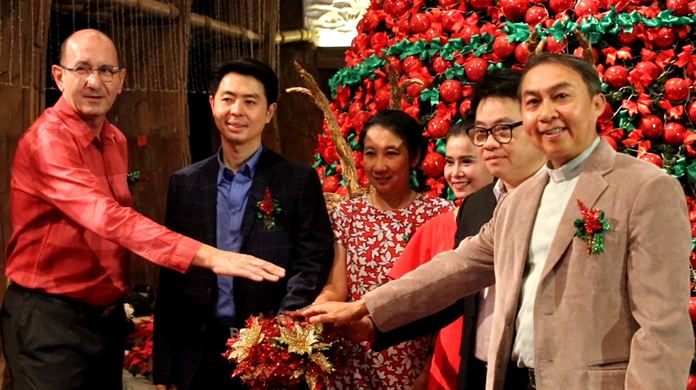Pattaya Deputy Mayor Poramet Ngampichet and General Manager Denis Thouvard flipped the switch to illuminate the giant Christmas tree at the Grand Mirage Beach Resort Pattaya to help raise money for charity.
