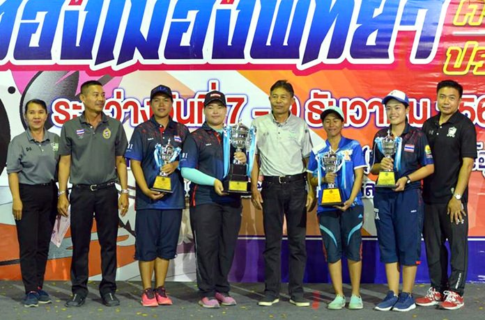 Winners pose with their trophies during the presentation ceremony for the 18th Pattaya Petanque Tournament at Pattaya School No. 2, Sunday, December 9.