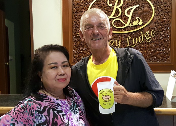 Lek from BJ Holiday Lodge (left) presents the monthly mug to Mick Coghlan.