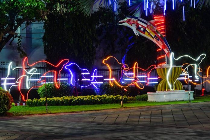 Pattaya is lit up for the holiday season with rainbow-colored dolphins.