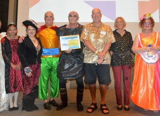 MC Roy Albiston poses with the cast of Pattaya Players Puss in Boots pantomime after presenting them with the PCEC’s Certificate of Appreciation.