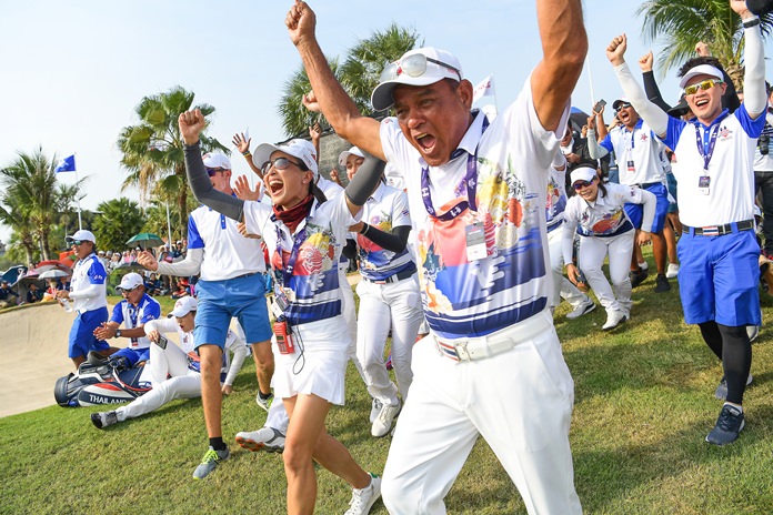 Thai players react after Kiradech Aphibarnrat makes a putt on the 18th green to secure victory for the home team. (Photo by: Naratip Golf Srisupab/SEALs Sports Images)