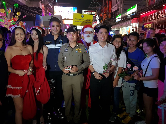 A police officer dressed as Santa Claus handed out lollipops as authorities made a public-relations visit to Walking Street.