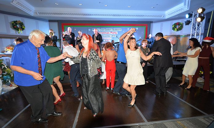 Rotarians and community activists dance to the sounds of B2F during the Rotary Club of the Eastern Seaboard’s annual holiday party.