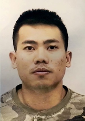 This undated photo provided by the Indianapolis Police Department shows Peter Van Bawi Lian. Authorities say the 21-year-old soldier who flew from Colorado to Indiana and allegedly killed his wife, then fled to Thailand, is now wanted for military desertion. (Indianapolis Police Department via AP)