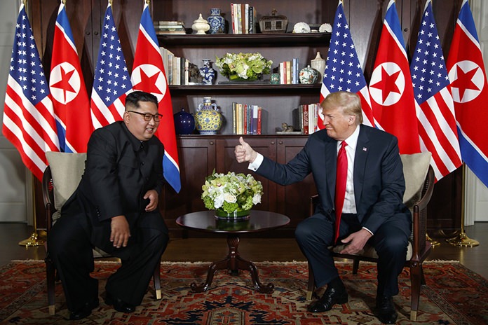 U.S. President Donald Trump, right, meets with North Korean leader Kim Jong Un on Sentosa Island in Singapore on June 12, 2018. (AP Photo/Evan Vucci)