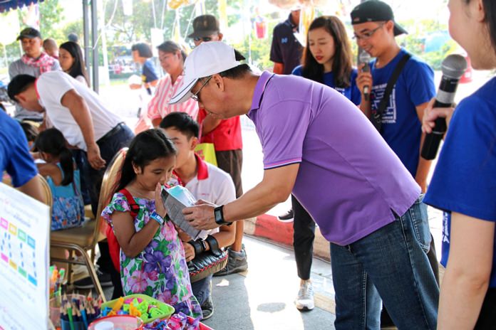 General Manager Neoh Kean Boon hands out snacks and gifts to deserving children on National Children’s Day.