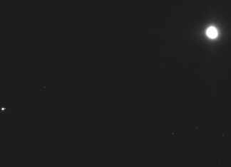 This image captured on Dec. 19, 2018, by a camera on the Osiris-Rex spacecraft shows the asteroid Bennu, top right, about 27 miles (43 kilometers) from the spacecraft, and the Earth and moon, bottom left, more than 70 million miles (110 million kilometers) away. (NASA/Goddard/University of Arizona/Lockheed Martin Space via AP)