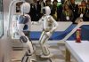 The Walker robot grabs a soda can during a demonstration at the Ubtech booth at CES International, Wednesday, Jan. 9, 2019, in Las Vegas. (AP Photo/John Locher)