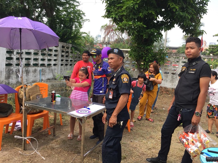 A future police woman? Kids were tested for accuracy in the airsoft gun shooting contest for prizes.