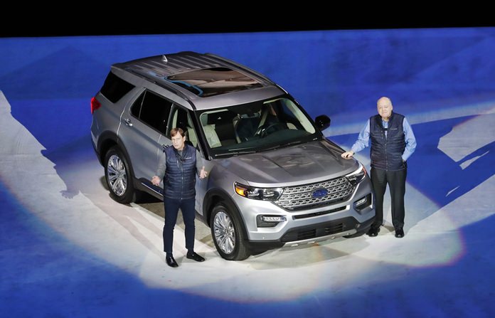 Ford Motor Co., President, Global Markets Jim Farley (left) and President and CEO Jim Hackett stand next to the redesigned 2020 Ford Explorer during its unveiling, Wednesday, Jan. 9, in Detroit. (AP Photo/Carlos Osorio)