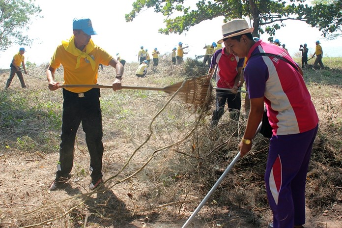 Local government workers, volunteers and students pitched in to clean up a wooded area around the Banglamung Home for Boys envisioned as a future activity zone.