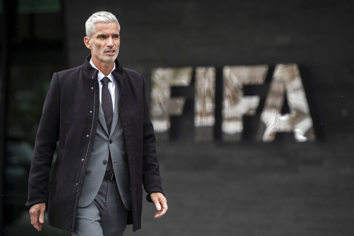 Former Australian national team captain Craig Foster walks outside FIFA headquarters in Zurich, Switzerland, on Monday, Jan. 28. (Ennio Leanza/Keystone via AP)