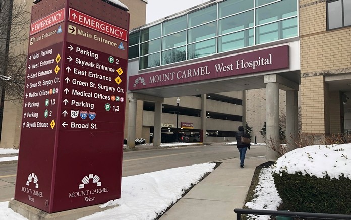 The main entrance to Mount Carmel West Hospital is shown Tuesday, Jan. 15, 2019. An intensive care doctor ordered “significantly excessive and potentially fatal” doses of pain medicine for over two dozen near-death patients in the past few years. (AP Photo/Andrew Welsh Huggins)