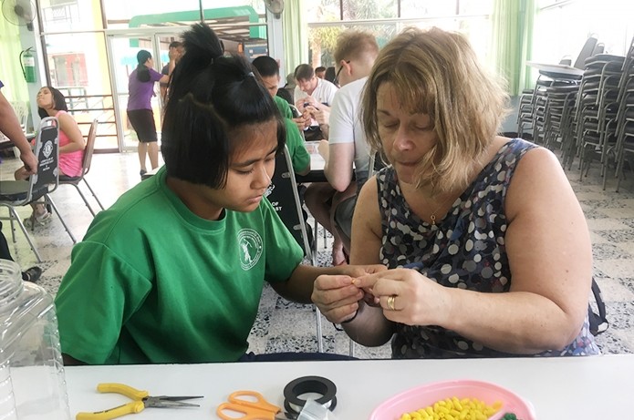 Learning to make key rings.
