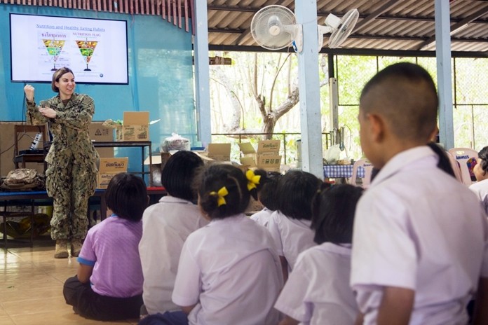U.S. Navy 1st Lt. Pamela Foss teaches students from the Ban Man Kroi School about nutrition during exercise Cobra Gold 19 at Ban Man Kroi School, Rayong, Feb. 5, 2019. (U.S. Marine Corps photo by Lance Cpl. Kenny Nunez.)