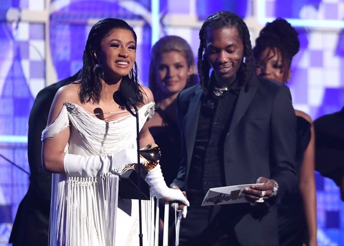 Cardi B (left) accepts the award for best rap album for “Invasion of Privacy” as Offset looks on at the 61st annual Grammy Awards on Sunday, Feb. 10, in Los Angeles. (Photo by Matt Sayles/Invision/AP)