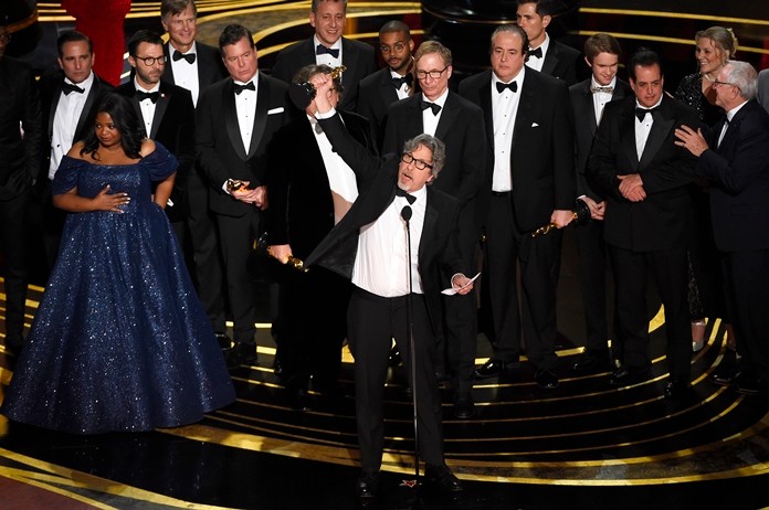 Peter Farrelly (center) and the cast and crew of “Green Book” accept the award for best picture at the Oscars on Sunday, Feb. 24, at the Dolby Theatre in Los Angeles. (Photo by Chris Pizzello/Invision/AP)