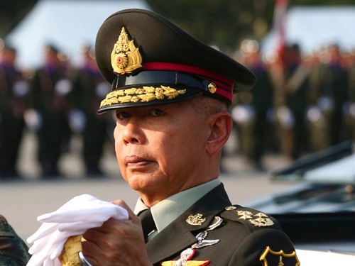 In this Friday, Jan. 18, 2019, file photo, Thai army chief Gen. Apirat Kongsompong reviews the guard of honor during the Royal Thai Armed Forces Day ceremony at a military base in Bangkok. (AP Photo/Sakchai Lalit)