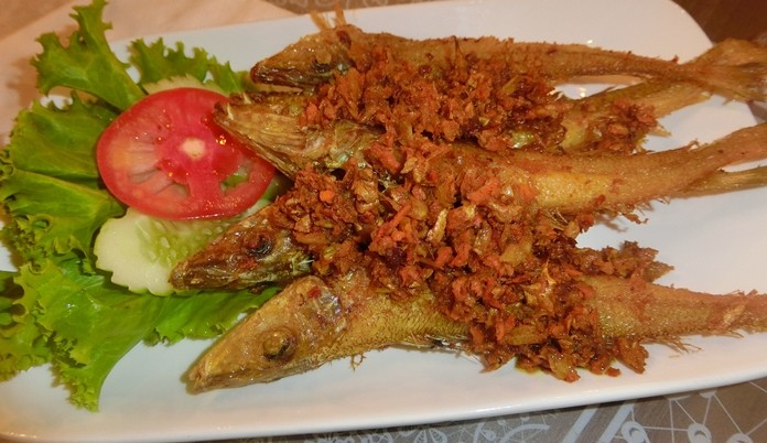 Fried whiting fish with yellow ginger tastes as good as it looks.