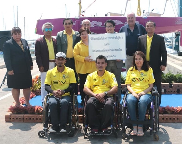 SAT Gov. Kongsak Yodmanee presides over the handover ceremony at Ocean Marina Yacht Club for the first teak sailboat designed to be skippered by the disabled.