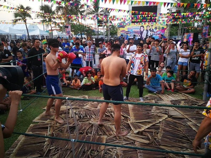 Muay Tub Jak, blindfolded boxing, gets the crowds’ spirits up.