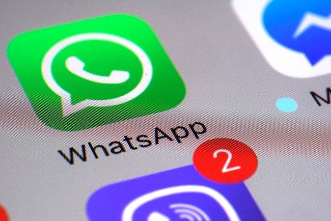 WhatsApp says a vulnerability in the popular communications app let mobile phones be infected with sophisticated spyware with a missed in-app call alone. (AP Photo/Patrick Sison, File)