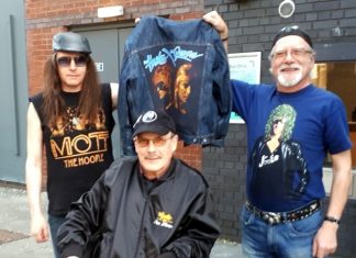 Three Mott the Hoople fans outside the Beacon Theatre wear t-shirts individually designed and hand painted in Thailand.