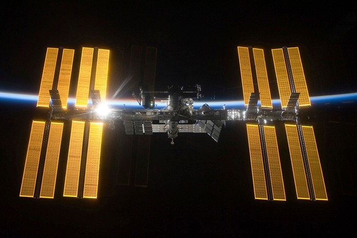 The International Space Station as seen from the Space Shuttle Discovery during separation.  NASA announced Friday, June 7, 2019 that it will open the International Space Station to private astronauts, with the first visit as early as next year. The round-trip ticket will cost an estimated $58 million. And accommodations aboard the orbiting outpost will run about $35,000 per night, for trips of up to 30 days long.  (NASA via AP)