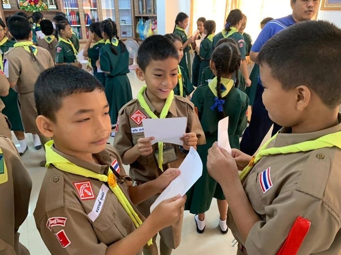 (Above) Young men play the foundation’s Child Protection Card Game.