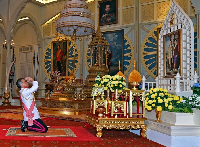 His Majesty King Maha Vajiralongkorn Phra Vajiraklaochaoyuhua pays his respects to a portrait of HM the late King Bhumibol Adulyadej and HM Queen Sirikit at the Dusit Palace Thursday, Dec.1, 2016.