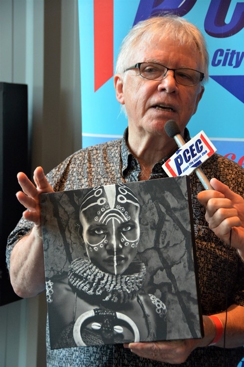 Glen Allison, during his interview by PCEC member Ren Lexander, shows one of his photographs of a model that he has used various paint schemes and props to make visually attractive and interesting.