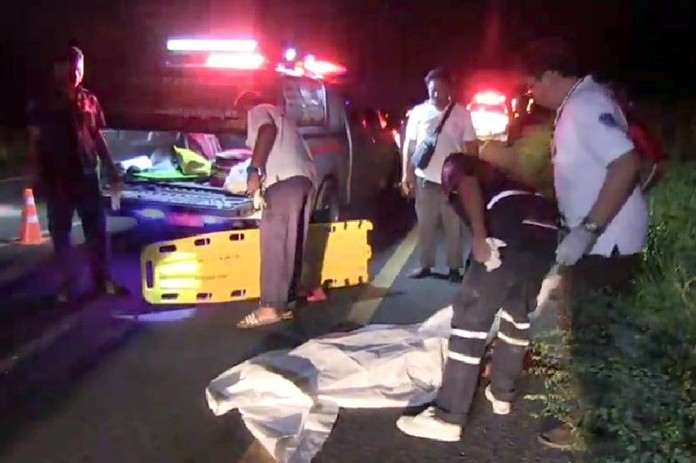 Emergency service personnel attend the scene of a fatal road traffic accident July 26 on Highway 331 in Huay Yai.