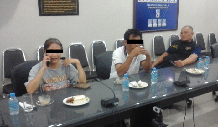 Suriya Singchart (center) and Panarada Aiyasupa (left) were charged with fraud for allegedly scamming 20 people out of more than 1.6 million baht.